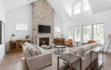 A living area with window blinds and discrete lighting fixtures.