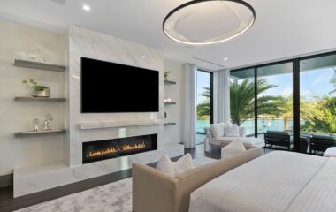 Luxury Boca Estate bedroom and outdoor deck and pool.