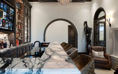 A stylish Frisco residence bar area with TV.