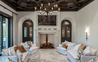 A stylish Frisco residence living room with TV and fireplace.