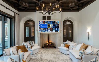 A stylish Frisco residence media room with fireplace.