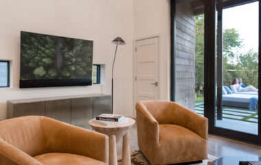 A luxury lakefront retreat living area with TV.