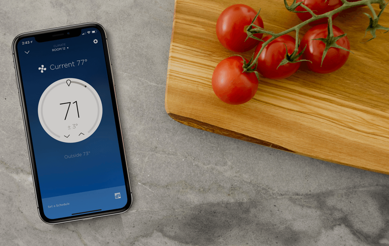 A smartphone with the Savant climate control app.